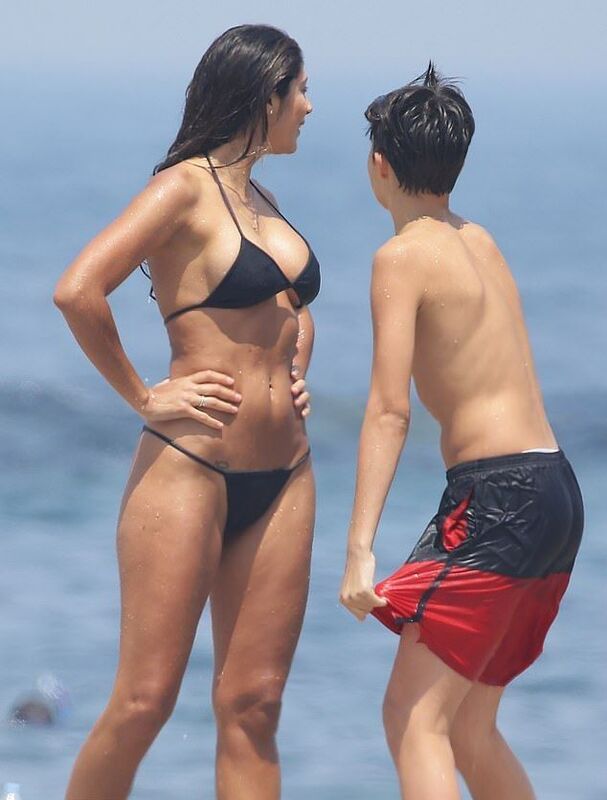21229714-7704331-Beach_body_The_mother_and_son_looked_out_at_the_water_they_appea-m-19_1574219...jpg